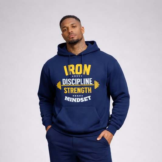 Man wearing a navy hoodie and shorts with motivational text, standing against a plain background