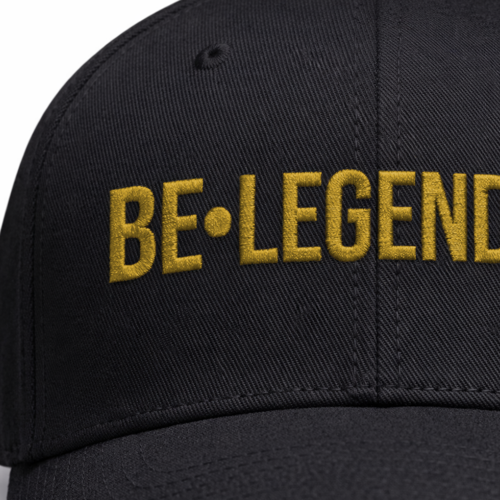 Black cap with 'BE•LEGENDARY' text in gold on a white background