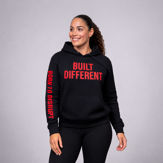Person wearing a black hoodie with 'Built Different' text on a gray background