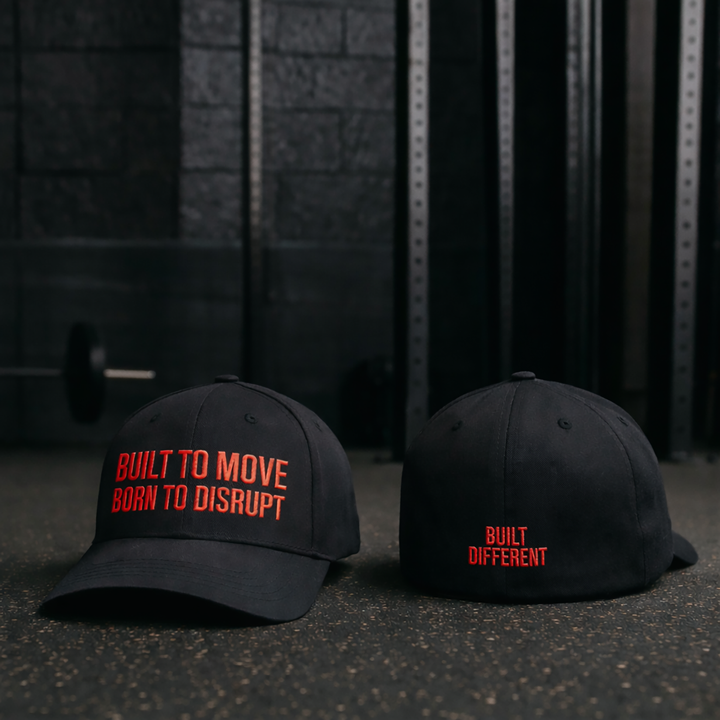 Two black caps with red text on a dark background